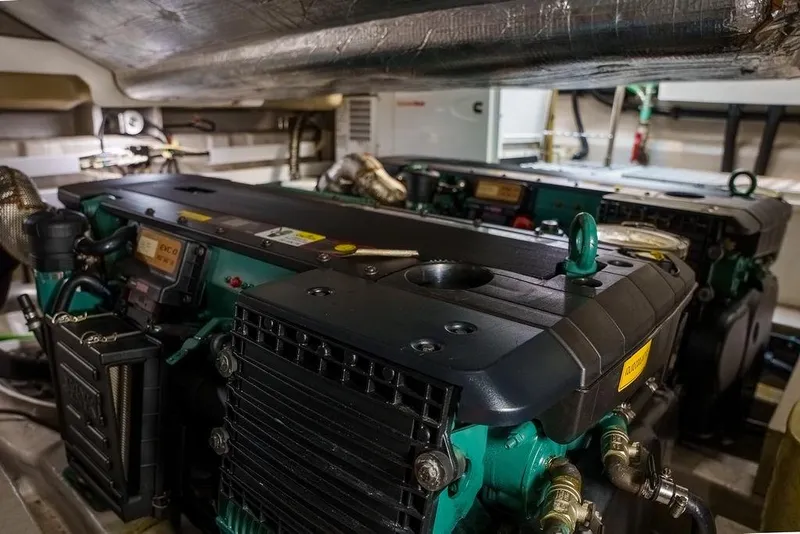 Slide: The Image of Engine room of a 2013 Sunseeker Portafino yacht, showcasing detailed machinery. - 76