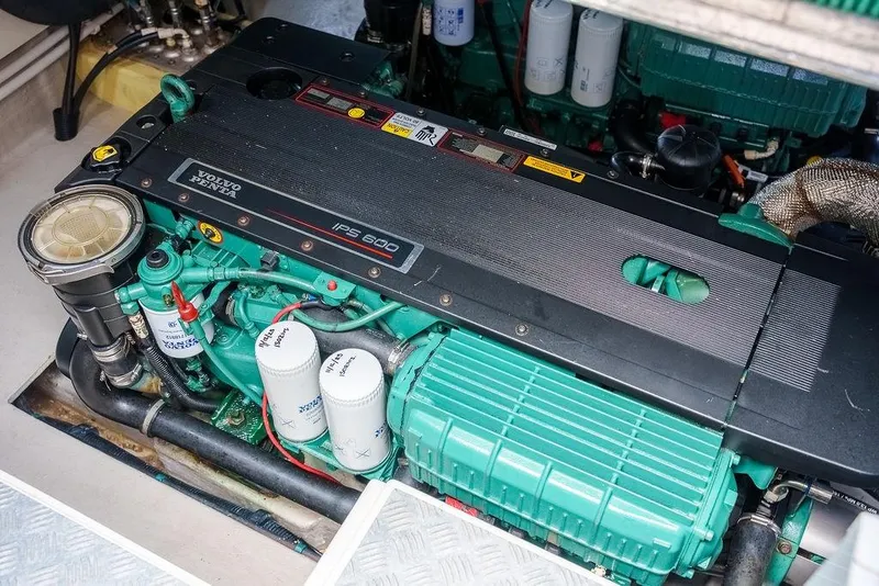 Slide: The Image of Engine room of 2013 Sunseeker Portafino yacht, featuring a powerful marine engine. - 78