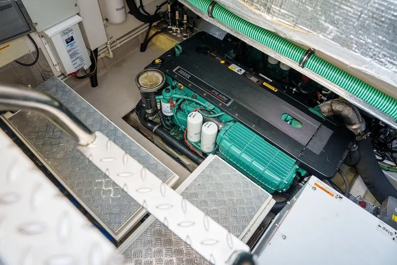 Slide: The Image of Engine room of 2013 Sunseeker Portafino yacht with blue tank and fire extinguishers. - 79