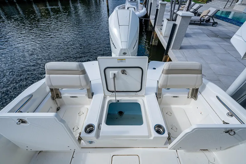 Slide: The Image of 2023 Boston Whaler 250 Dauntless boat interior with seating and storage compartments. - 18