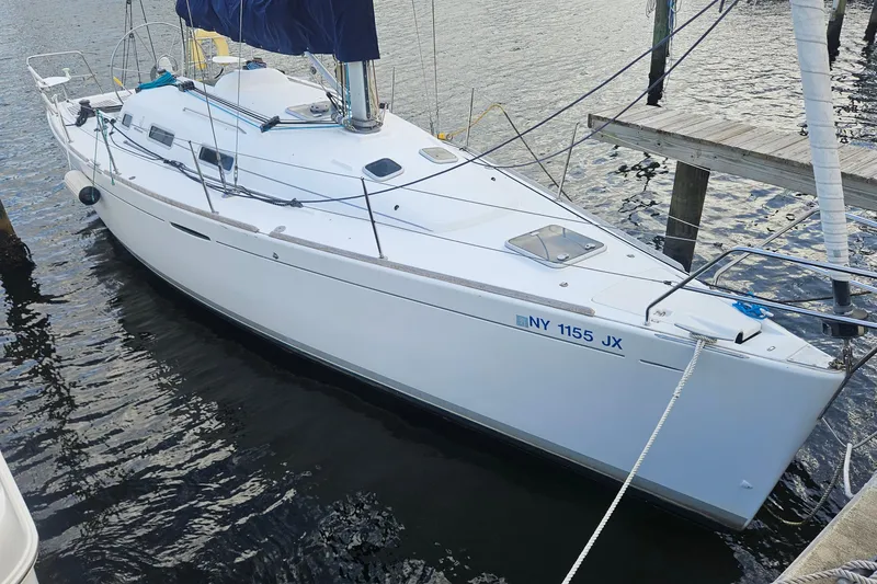 The Image of 2004 Beneteau First 36.7 sailboat docked in calm waters. - 0