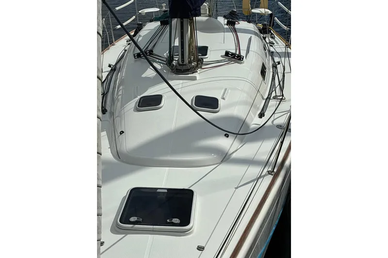 Slide: The Image of 2004 Beneteau First 36.7 sailboat deck with hatches and rigging. - 3
