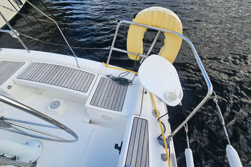 Slide: The Image of Beneteau First 36.7 sailboat deck, 2004 model, featuring seating and safety equipment. - 5