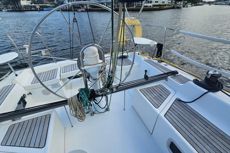 Slide: The Image of Cockpit of 2004 Beneteau First 36.7 sailboat with steering wheel and ropes. - 6