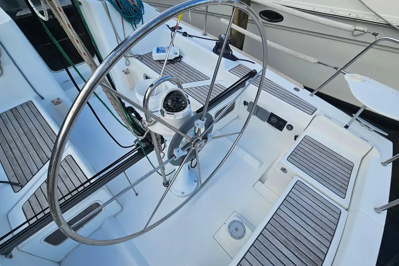 Slide: The Image of Steering wheel of 2004 Beneteau First 36.7 sailboat with wooden deck details. - 9