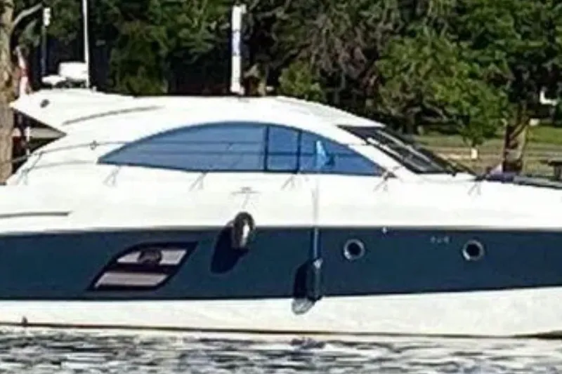 The Image of 2015 Beneteau Gran Turismo 49 yacht cruising on water, side view. - 1