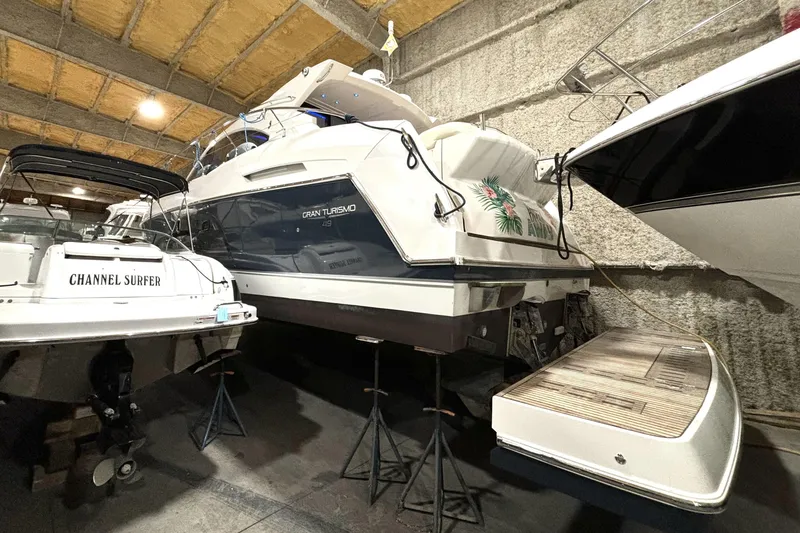 Slide: The Image of 2015 Beneteau Gran Turismo 49 yacht in storage, alongside other boats. - 10