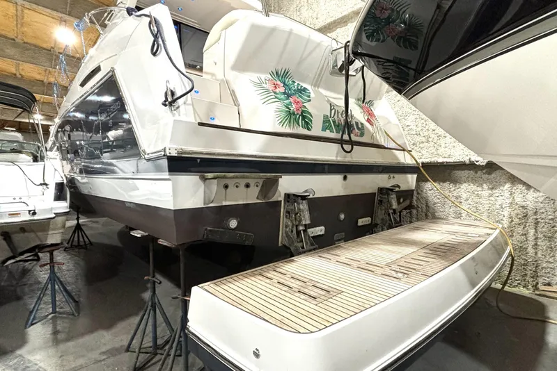 Slide: The Image of 2015 Beneteau Gran Turismo 49 yacht in storage, rear view with tropical design. - 11