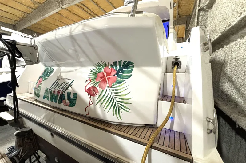 Slide: The Image of 2015 Beneteau Gran Turismo 49 yacht with tropical-themed design in storage. - 13