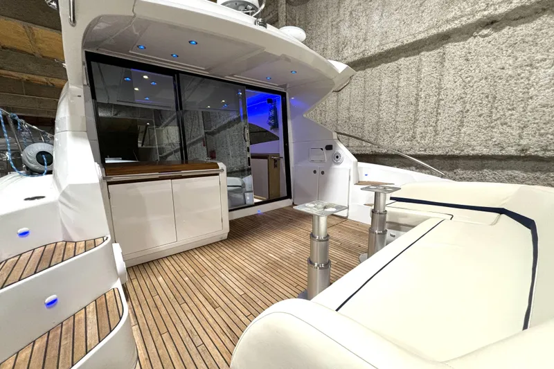 Slide: The Image of 2015 Beneteau Gran Turismo 49 yacht interior with sleek design and wooden flooring. - 15