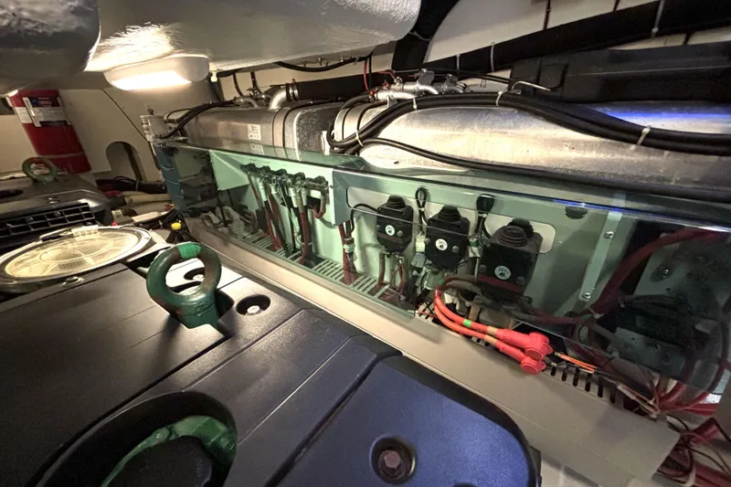 Slide: The Image of Engine room of 2015 Beneteau Gran Turismo 49 yacht, showcasing mechanical components. - 21