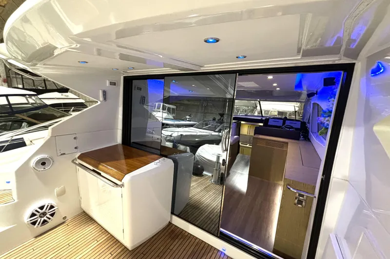 Slide: The Image of 2015 Beneteau Gran Turismo 49 yacht interior with modern design and ambient lighting. - 33