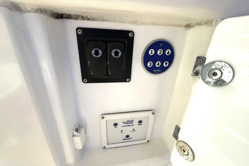 Slide: The Image of Control panel on a 2015 Beneteau Gran Turismo 49 yacht, featuring buttons and switches. - 34