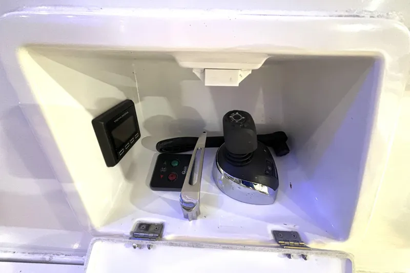 Slide: The Image of Control panel of 2015 Beneteau Gran Turismo 49 yacht, featuring joystick and display. - 35