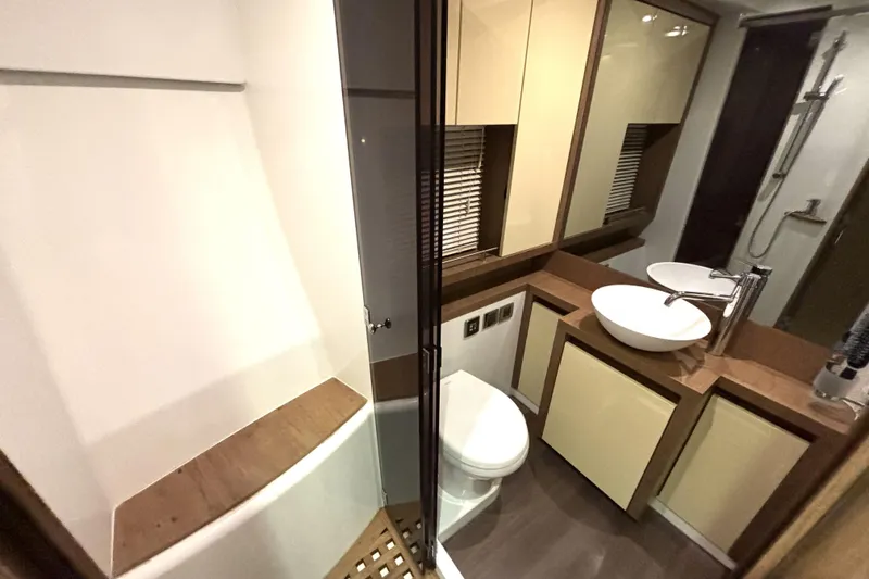 Slide: The Image of Luxurious bathroom in 2015 Beneteau Gran Turismo 49 yacht, featuring modern fixtures and elegant design. - 39