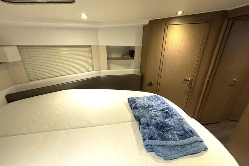Slide: The Image of Luxurious cabin interior of 2015 Beneteau Gran Turismo 49 yacht with cozy bedding. - 40