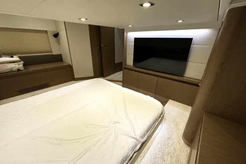 Slide: The Image of Luxurious interior of 2015 Beneteau Gran Turismo 49 yacht with modern bedroom and TV. - 45