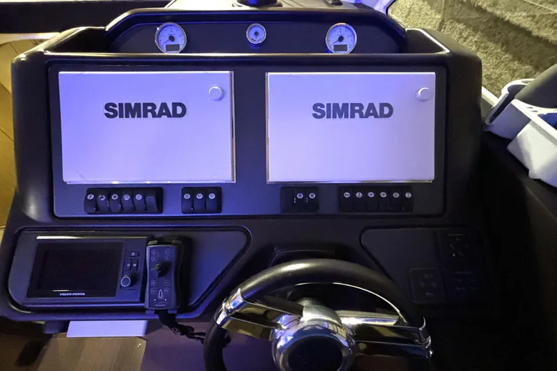 Slide: The Image of Control panel of 2015 Beneteau Gran Turismo 49 with Simrad navigation displays. - 55