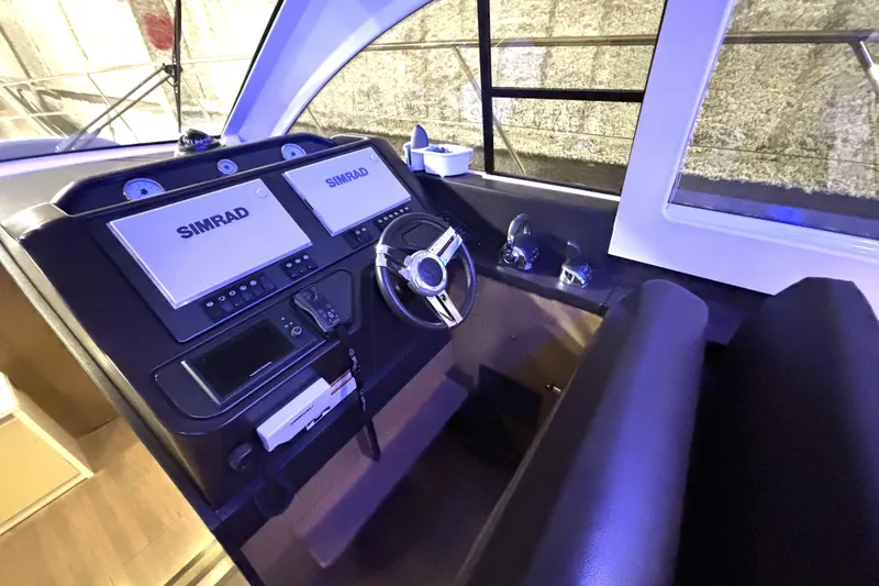 Slide: The Image of Helm of 2015 Beneteau Gran Turismo 49 with Simrad navigation displays. - 57