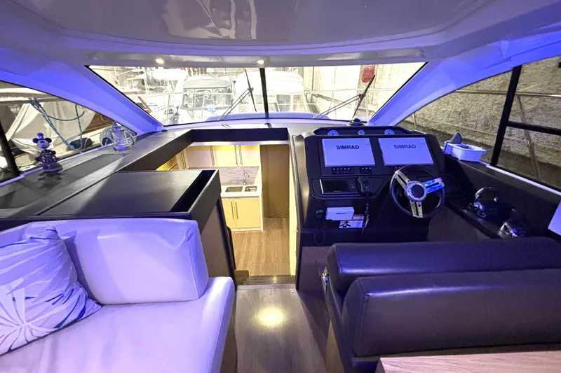 Slide: The Image of Interior of 2015 Beneteau Gran Turismo 49 yacht with modern helm and seating. - 58