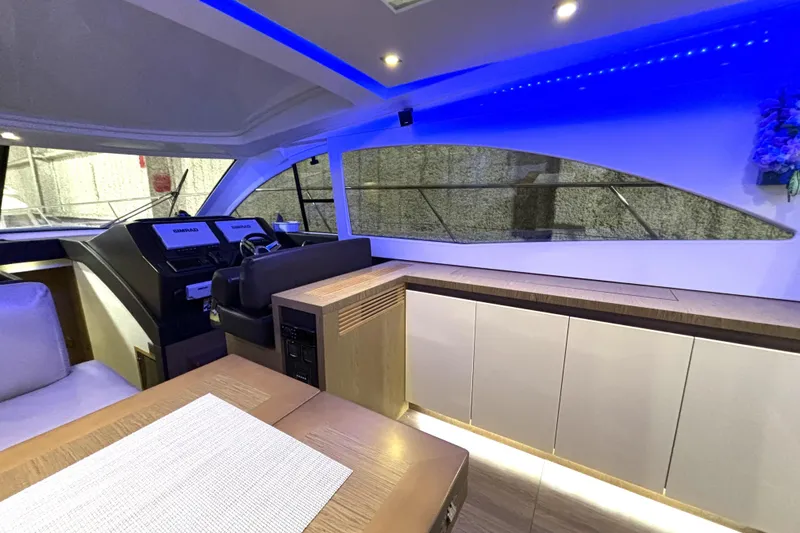 Slide: The Image of Interior of 2015 Beneteau Gran Turismo 49 yacht with modern design and blue LED lighting. - 59
