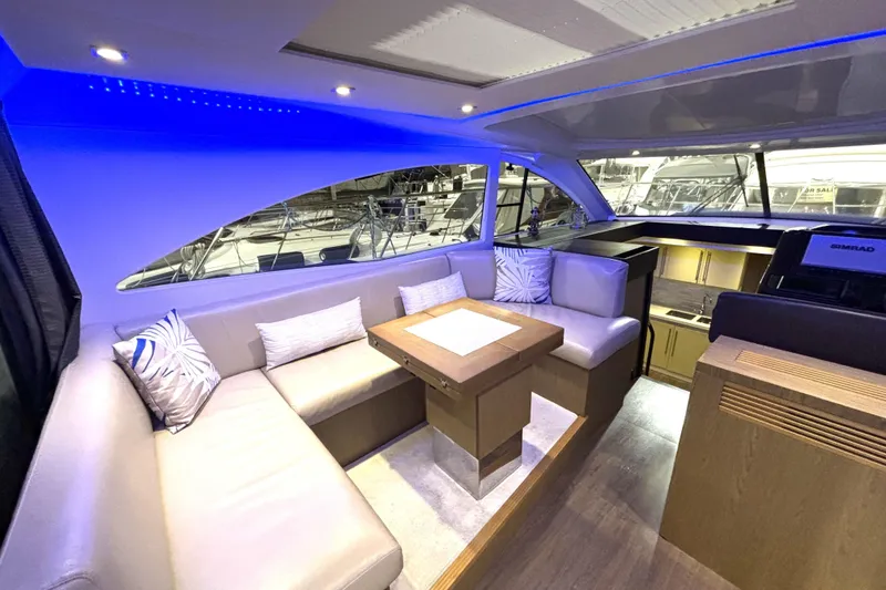 Slide: The Image of Luxurious interior of 2015 Beneteau Gran Turismo 49 yacht with modern seating and ambient lighting. - 60