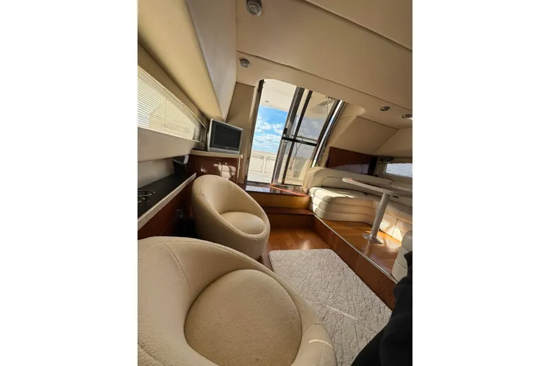 Slide: The Image of Luxurious interior of 2005 Regal Commodore 3880 yacht with plush seating and modern design. - 14