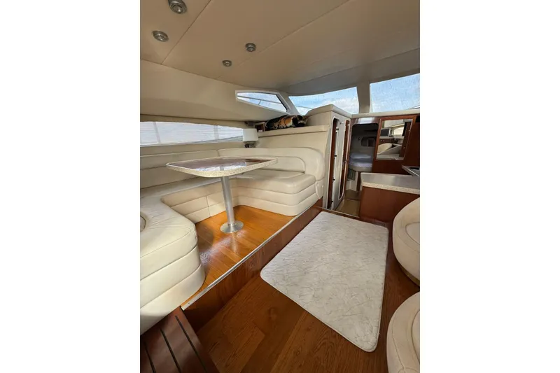 Slide: The Image of Luxurious interior of 2005 Regal Commodore 3880 yacht with plush seating and elegant wood finishes. - 15