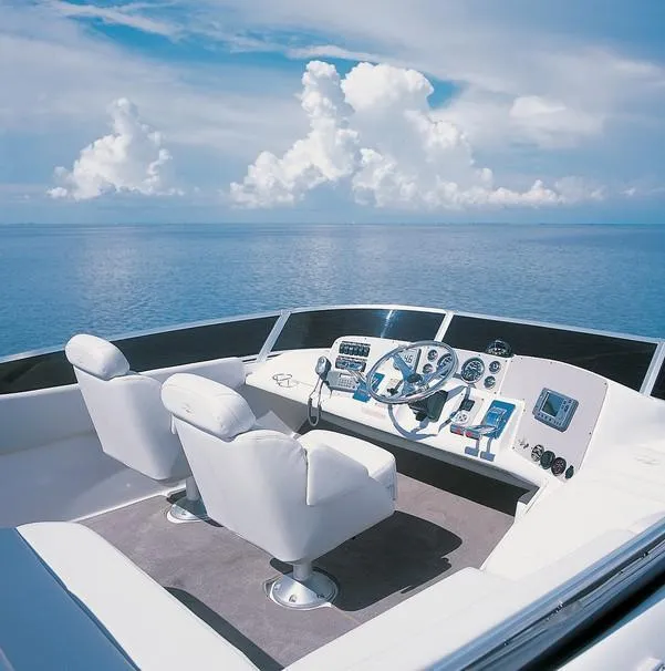 Slide: The Image of 2005 Regal Commodore 3880 boat docked under cloudy sky. - 2