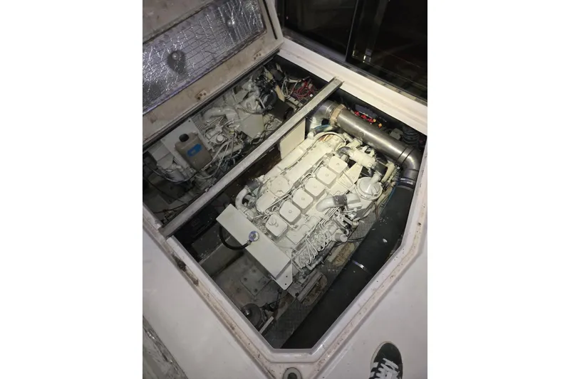 Slide: The Image of Engine compartment of 2005 Regal Commodore 3880 boat, showcasing mechanical components. - 21
