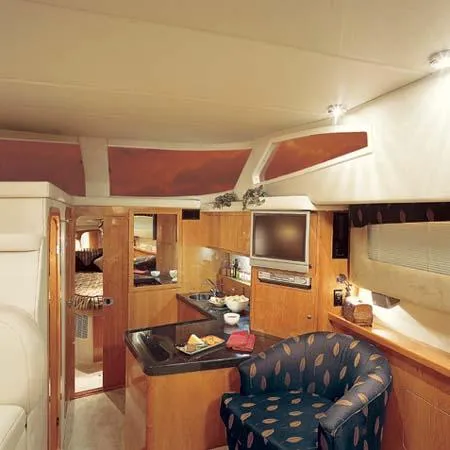 Slide: The Image of 2005 Regal Commodore 3880 helm with dual seats and control panel, overlooking water. - 4