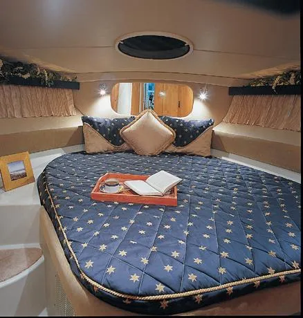 Slide: The Image of 2005 Regal Commodore 3880 yacht with sliding glass doors and blue sky reflection. - 6