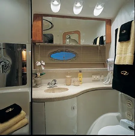 Slide: The Image of 2005 Regal Commodore 3880 boat deck with white seating and flooring. - 7