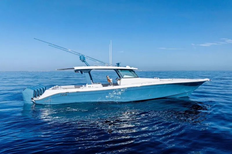 The Image of 2025 HCB 56 Suenos GIX luxury boat cruising on calm blue ocean waters. - 1