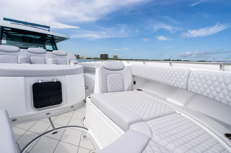 Slide: The Image of Luxurious seating on 2025 HCB 56 Suenos GIX yacht under clear blue sky. - 20