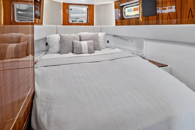 Slide: The Image of Luxurious cabin interior of 2025 HCB 56 Suenos GIX yacht with elegant bedding. - 21