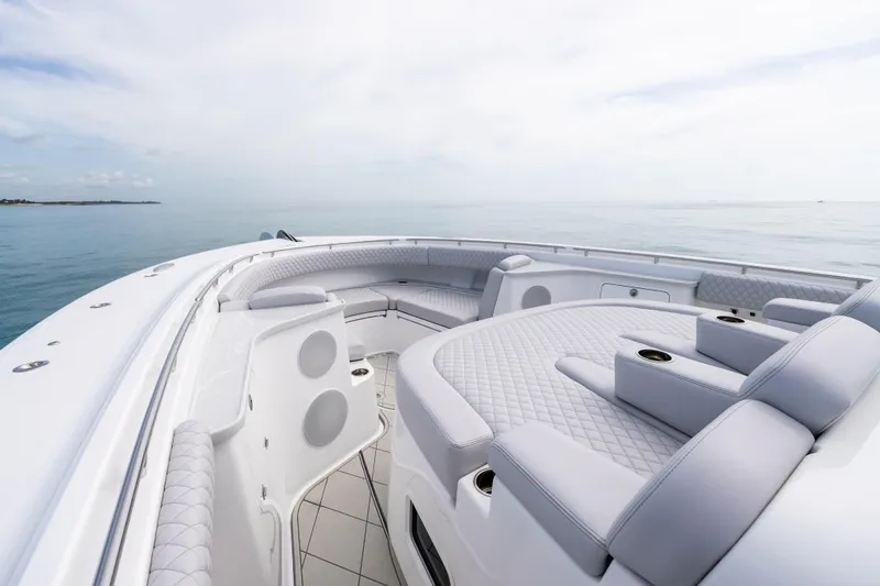 Slide: The Image of Luxurious 2025 HCB 56 Suenos GIX yacht interior with plush seating and ocean view. - 22
