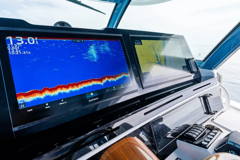 Slide: The Image of Helm of 2025 HCB 56 Suenos GIX with advanced navigation displays. - 23