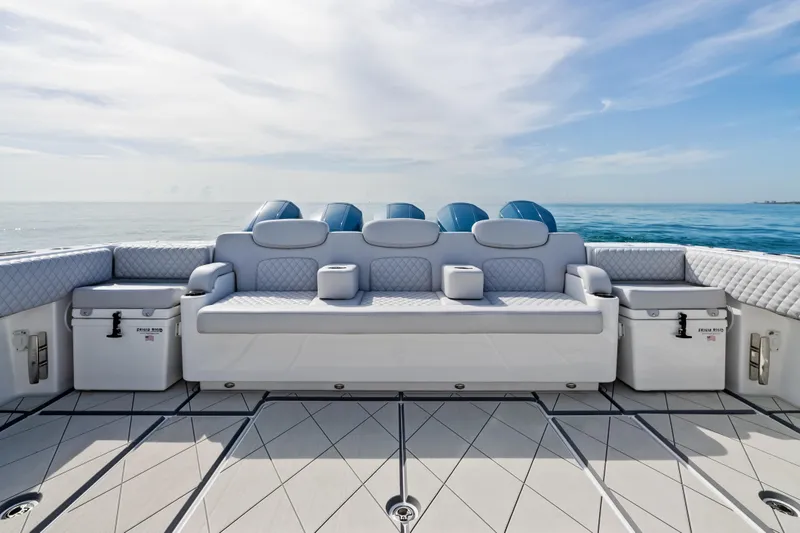 Slide: The Image of Luxury seating on 2025 HCB 56 Suenos GIX boat, ocean backdrop. - 25