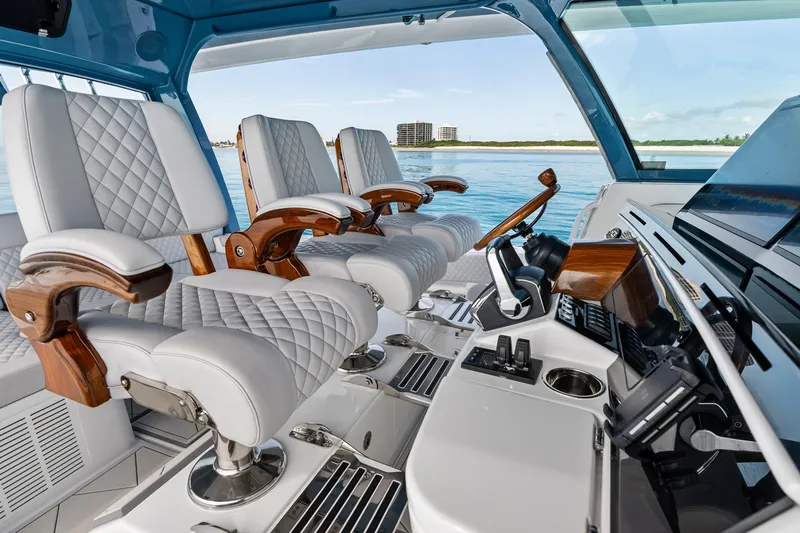 Slide: The Image of Luxurious interior of 2025 HCB 56 Suenos GIX yacht with plush seating and advanced controls. - 27