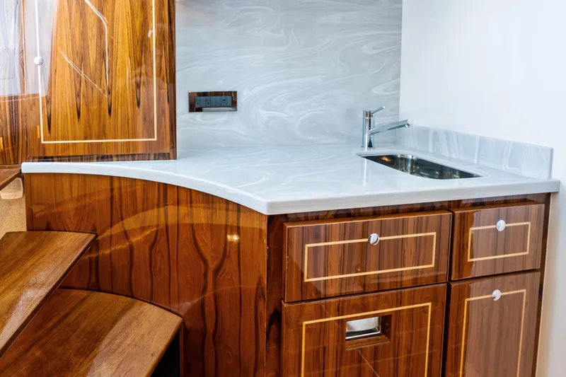 Slide: The Image of Luxurious wooden cabinetry and sleek sink in 2025 HCB 56 Suenos GIX yacht interior. - 33