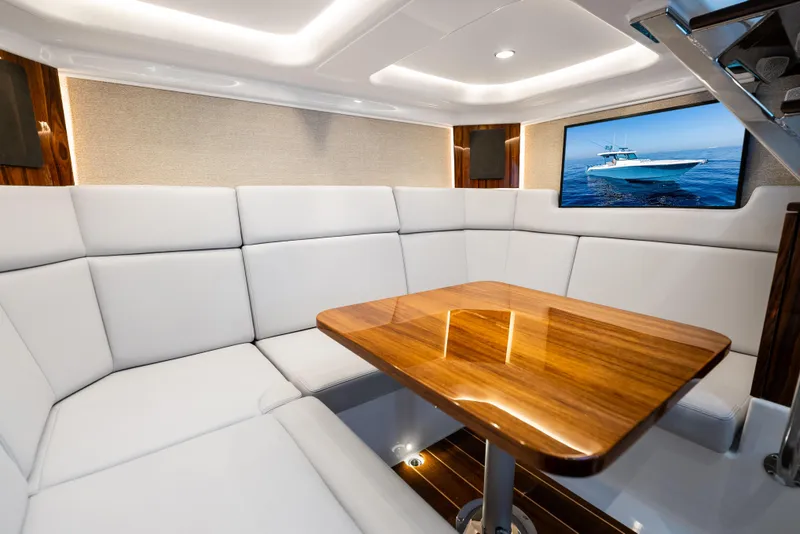 Slide: The Image of Luxurious interior of 2025 HCB 56 Suenos GIX yacht with elegant seating and wooden table. - 37