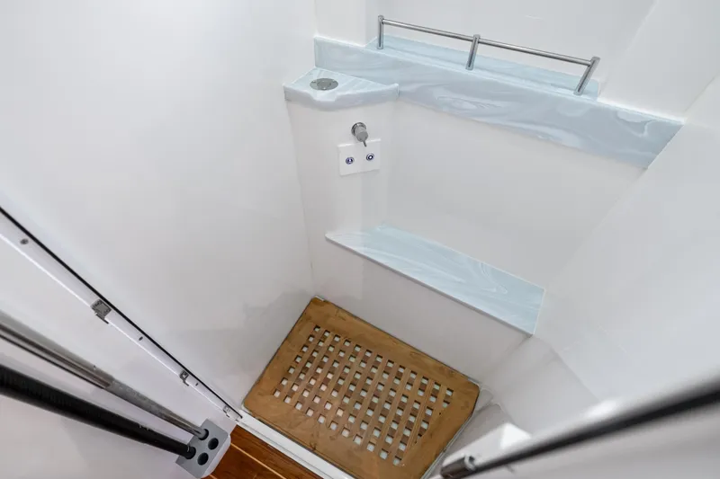 Slide: The Image of Shower area in 2025 HCB 56 Suenos GIX yacht with wooden floor and sleek design. - 49