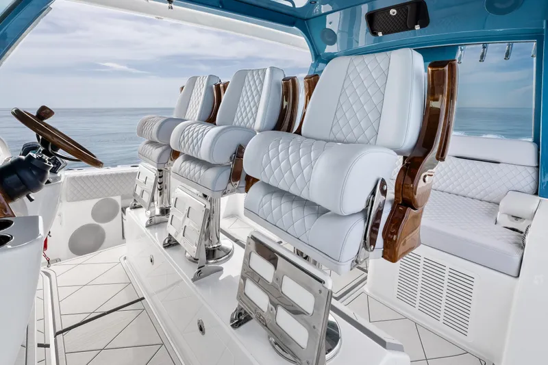 Slide: The Image of Luxurious interior of 2025 HCB 56 Suenos GIX yacht with plush seating and ocean view. - 7