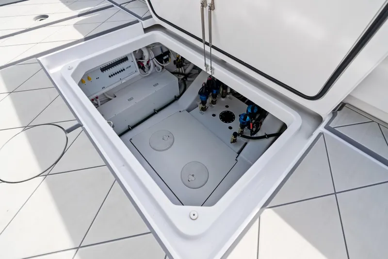 Slide: The Image of Open hatch of 2025 HCB 56 Suenos GIX, revealing internal components and wiring. - 8