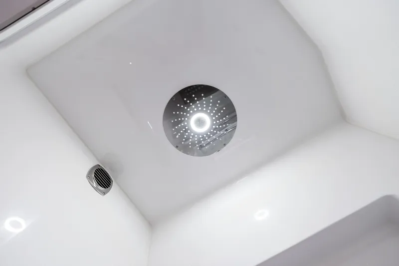 Slide: The Image of Ceiling view of 2025 HCB 56 Suenos GIX yacht interior with modern lighting. - 13