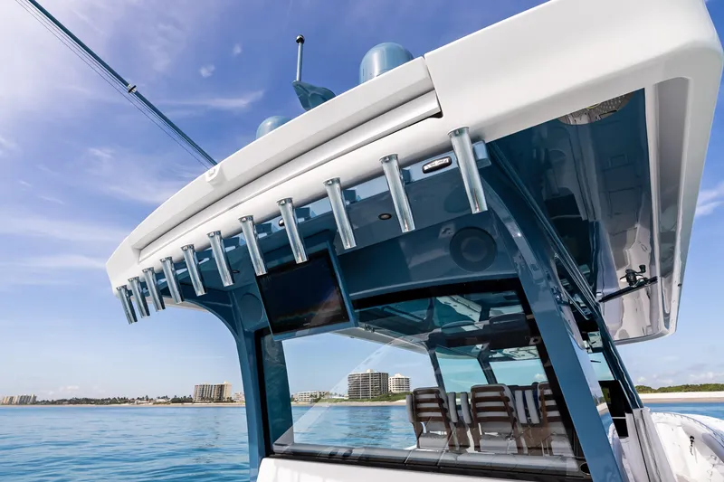 Slide: The Image of 2025 HCB 56 Suenos GIX boat, featuring sleek design and modern amenities on open water. - 35