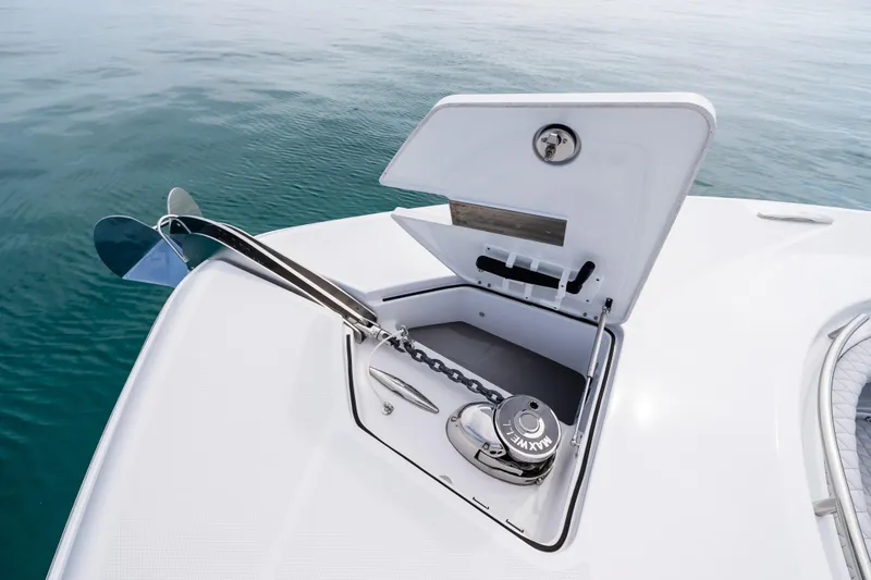 Slide: The Image of Anchor compartment of 2025 HCB 56 Suenos GIX yacht, open on calm water. - 39
