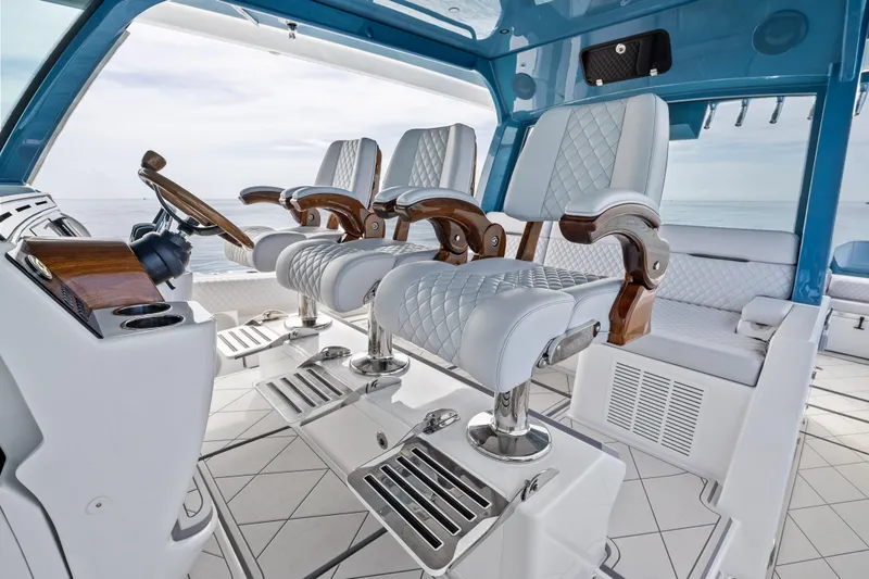 Slide: The Image of Luxury helm seating on 2025 HCB 56 Suenos GIX yacht, featuring elegant design and ocean view. - 44