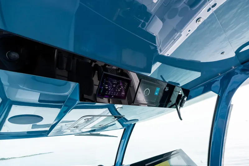 Slide: The Image of Interior view of 2025 HCB 56 Suenos GIX boat cockpit with advanced navigation displays. - 45